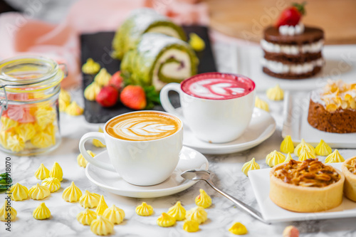 delicious composition of latte tea with cakes