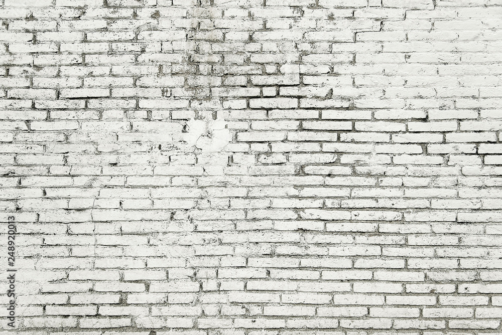 Old brick wall with white paint background texture Old brick wall with white paint background texture