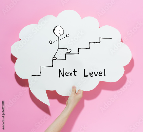 Foto Next level concept with a speech bubble on a pink background