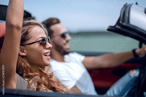 close up.a young woman with her boyfriend in a convertible car © ASDF