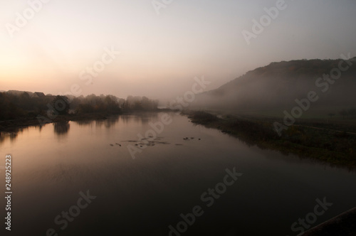 Fototapeta Naklejka Na Ścianę i Meble -  The river Neckar at an early cold morning with fog over the water