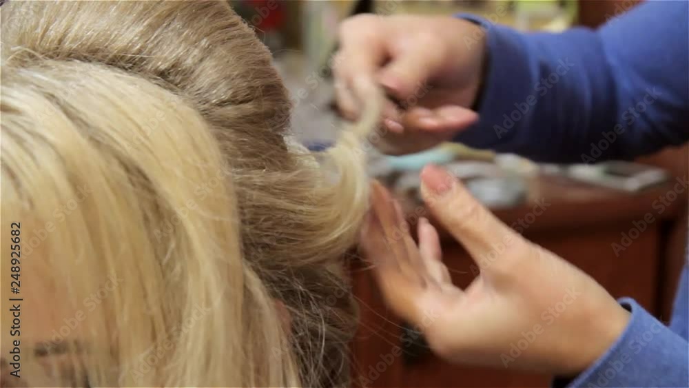 Professional hairdresser working with client in beauty salon Professional hairdresser working with client in beauty salon