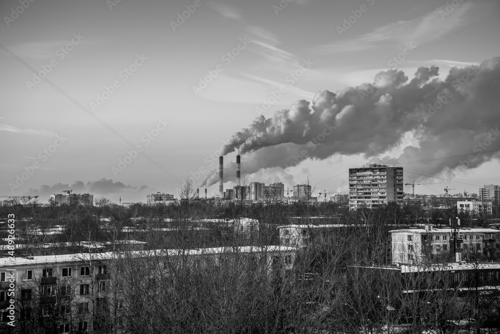 View of the city, poisoned by smoke from the factory pipes