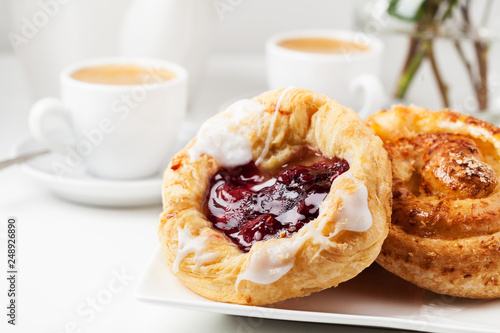 Breakfast setup with Danish pastries and coffee
