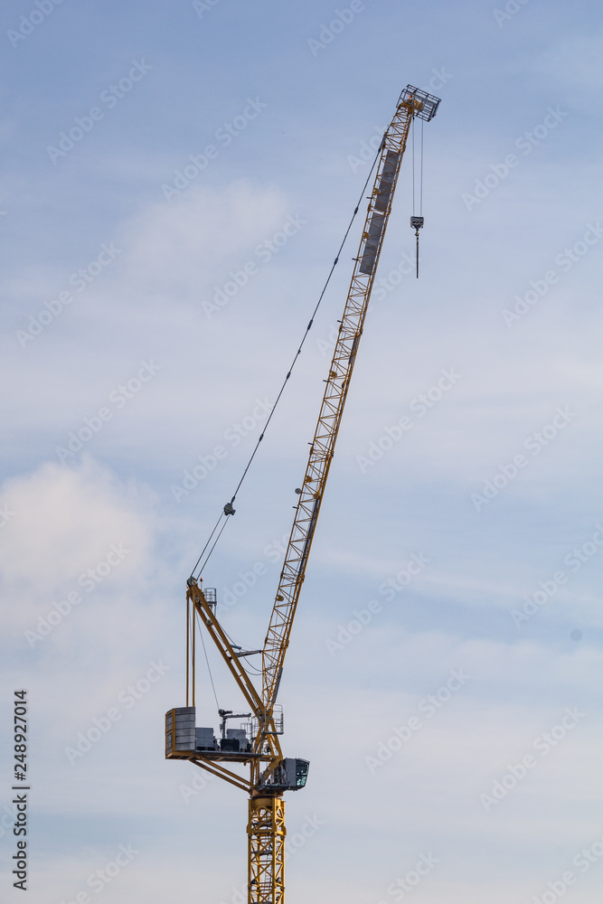 Crane on background of blue sky
