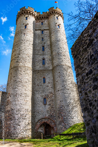 Kasselburg Castle, a ruined hill castle in Pelm, Rhineland-Palatinate, Germany against a beautiful April sky photo