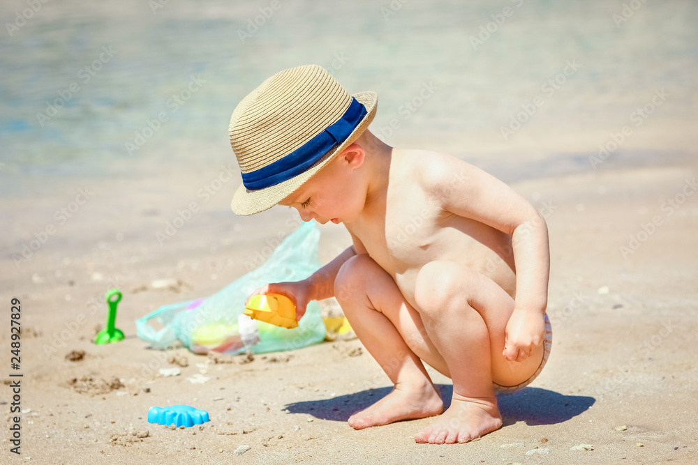 Happy child playing on the sea background Happy child playing on the sea background
