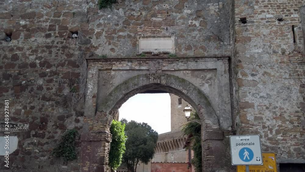 The ancient gate to access the medieval village of Ostia Antica - Rome The ancient gate to access the medieval village of Ostia Antica - Rome