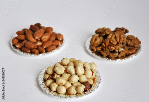 mixed nuts in a bowl isolated on white background
