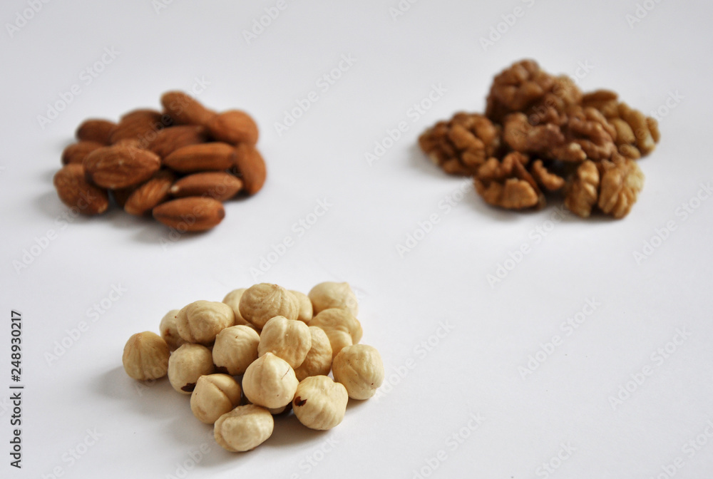 heap of mixed nuts isolated on white background heap of mixed nuts isolated on white background