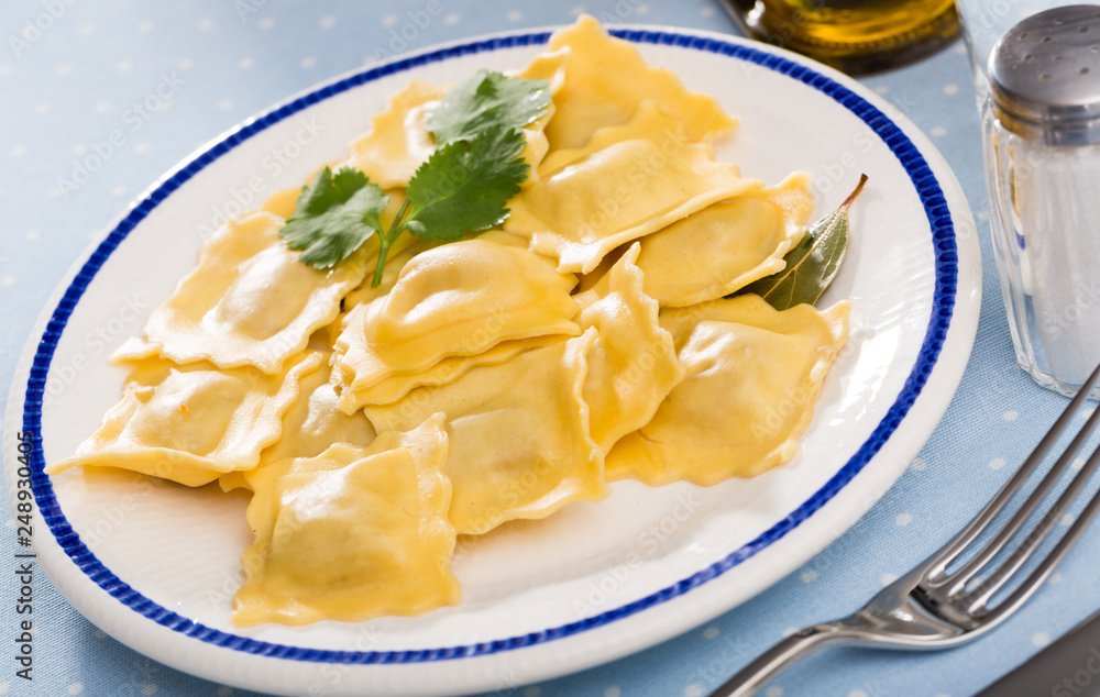 Delicious appetizing ravioli with bay leaf and black pepper