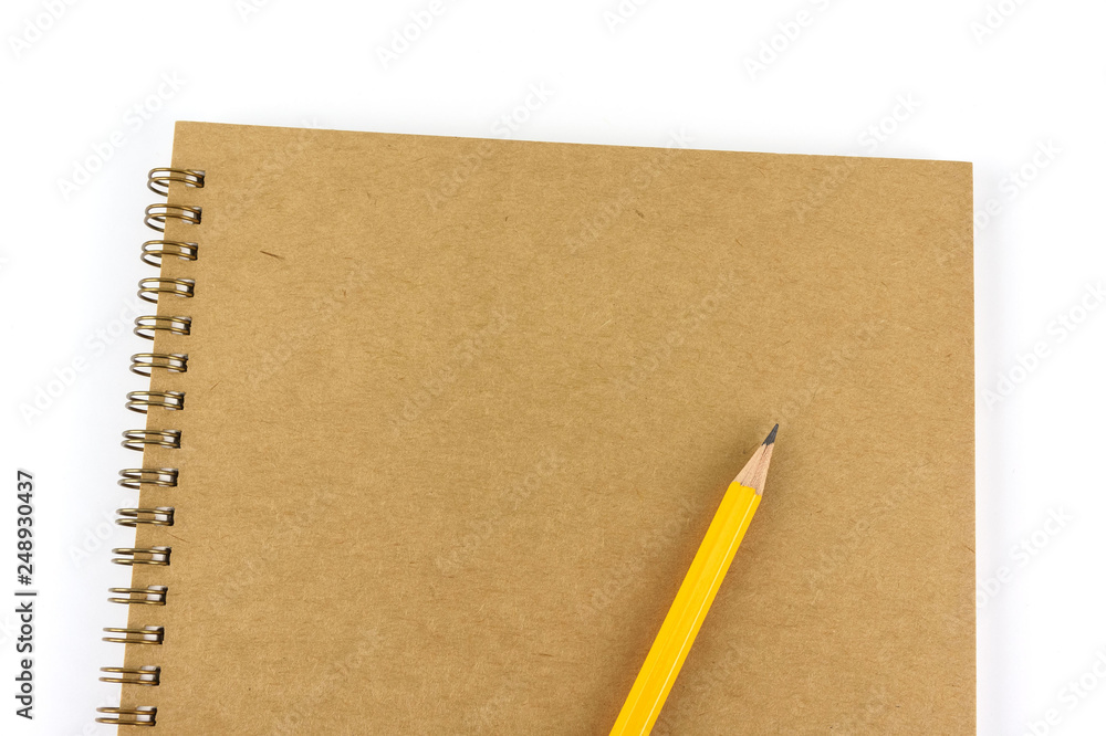 Recycled blank notebook front cover with pencil isolated on white background.