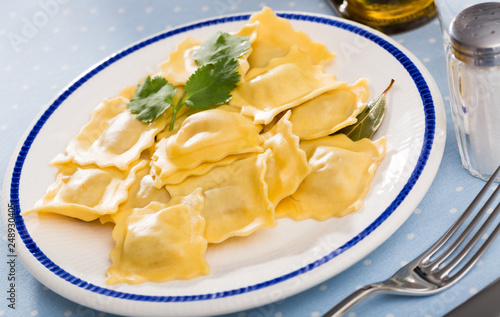 Delicious appetizing ravioli with bay leaf and black pepper
