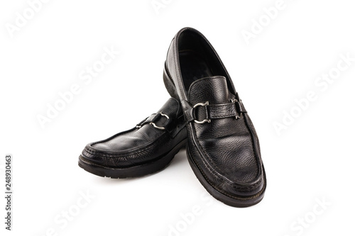 Black leather shoes isolated on white background with copy space.