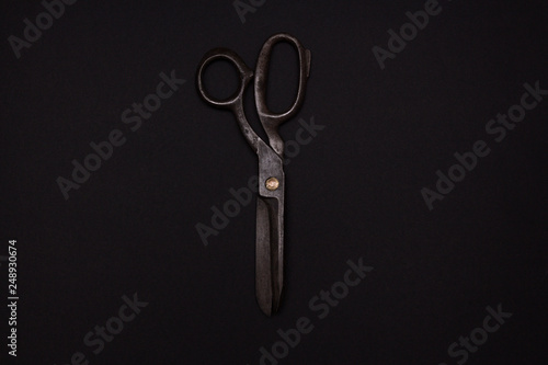 big old scissors on a black background
