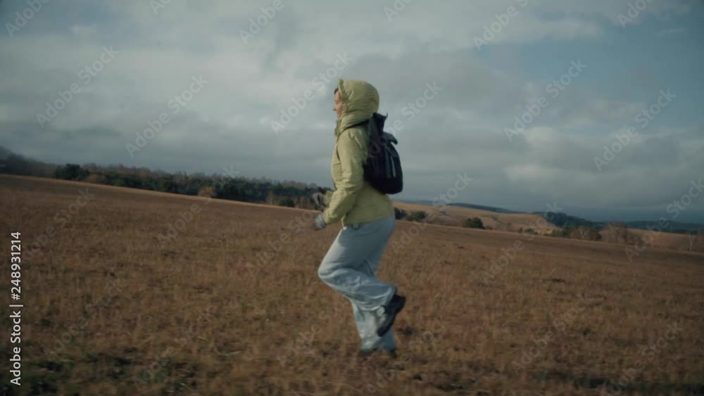 a girl runs across the field a girl runs across the field