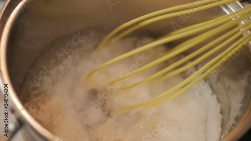 Sugar syrup with agar-agar boils in a saucepan for cooking marshmallows. Homemade