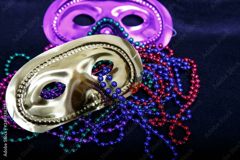 Purple and Gold Masks with Mardi Gras Beads Purple and Gold Masks with Mardi Gras Beads