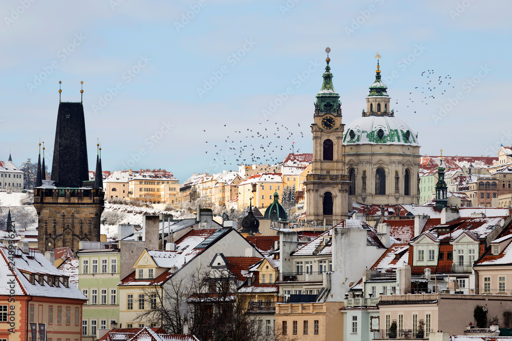 Snowy Prague Lesser Town with St. Nicholas' Cathedral, Czech republic