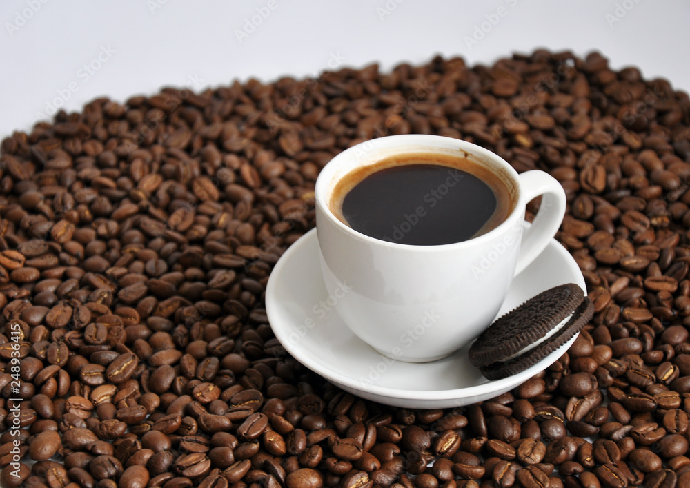cup of coffee and cookie with beans background cup of coffee and cookie with beans background