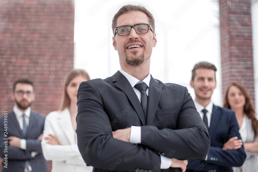 project Manager standing in front of his business team project Manager standing in front of his business team