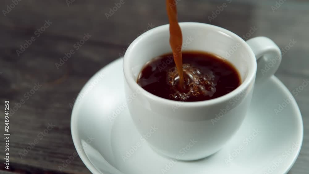 Pouring coffee in super slowmotion. Shooted with high speed cinema camera at 4K, 1000fps. Pouring coffee in super slowmotion. Shooted with high speed cinema camera at 4K, 1000fps.