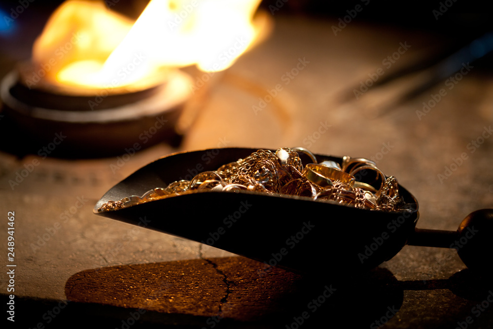 pieces of gold ready for melting in fire furnace