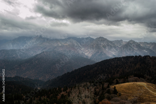Fototapeta Naklejka Na Ścianę i Meble -  gray sky with snowy mountains
