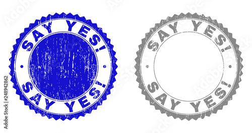 Grunge SAY YES! stamp seals isolated on a white background. Rosette seals with grunge texture in blue and gray colors. Vector rubber stamp imprint of SAY YES! text inside round rosette.