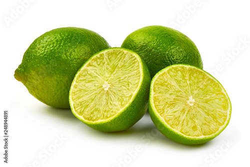 Fresh Ripe Lime with juicy half, close-up, isolated on white background