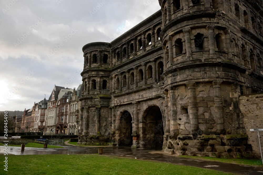 Trier / Germany - February 9 / 2019 : Rightside view from theouter side of PortaNigra, the roman entrance gate to Trier