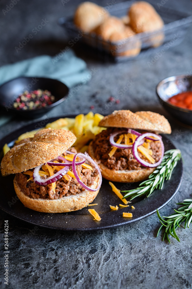 Sloppy Joe sandwich served with French fries Sloppy Joe sandwich served with French fries