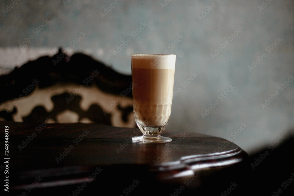 glass cup of coffee latte in the interior glass cup of coffee latte in the interior