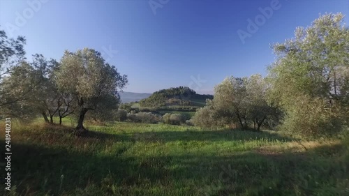 Drone aerial video on a Tuscany old village on the top of the hill at the first lights of the morning. photo