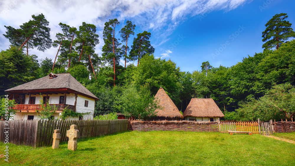 View of traditional romanian peasant houses in Transylvania, Romania.