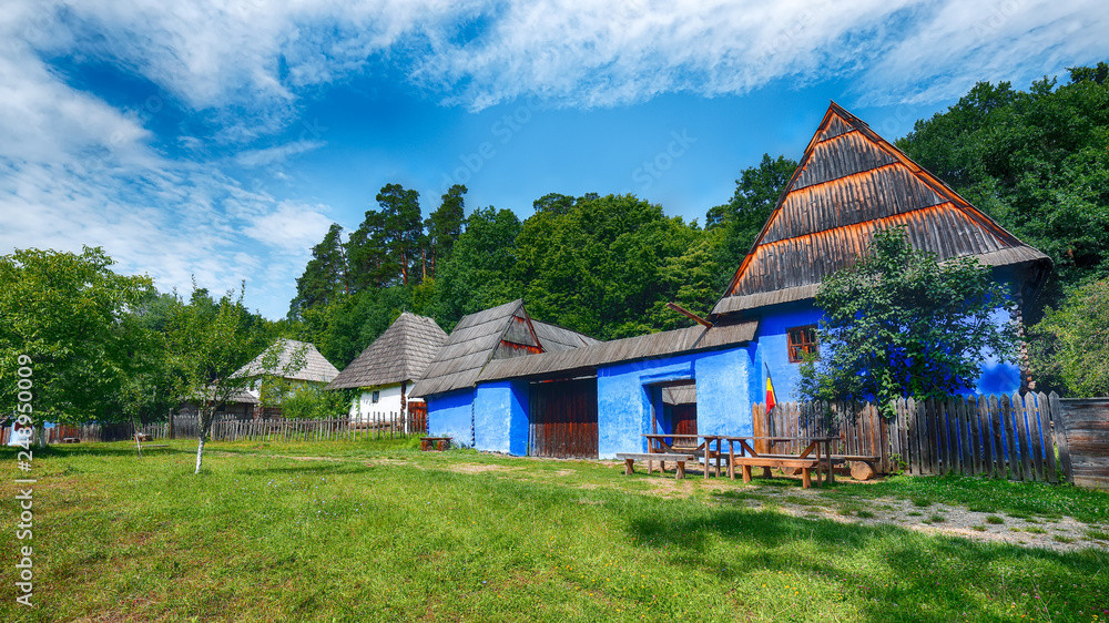 View of traditional romanian peasant houses in Transylvania, Romania.