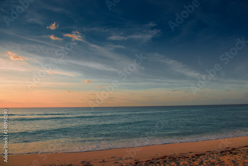Dawn on the Caribbean Sea. Clear sky with small clouds.
