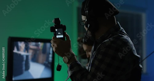 Young director giving instructions on a film set