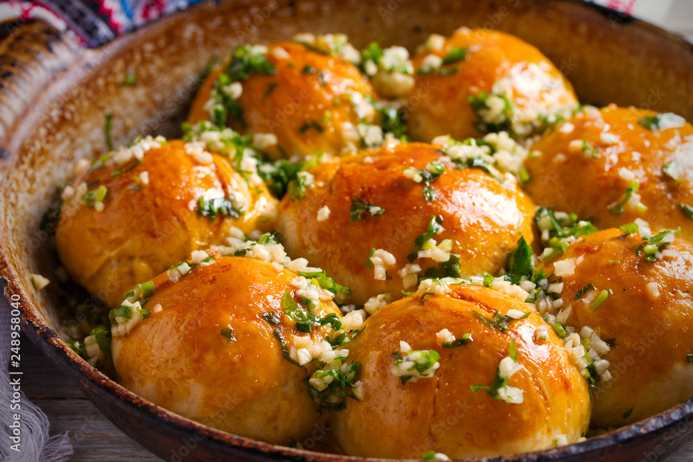 Garlic bread, buns. Bread rolls with garlic and parsley. horizontal Garlic bread, buns. Bread rolls with garlic and parsley. horizontal