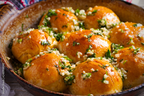 Garlic bread, buns. Bread rolls with garlic and parsley. horizontal