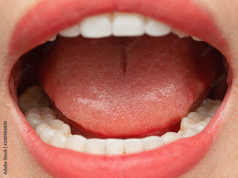 Obraz premium Closeup shot of Asian Chinese Thai woman female makeup face. Woman with red lips lipstick and healthy dental white great perfect teeth. Smiling, Dental dentist clinic concept. mouth open. wisdom tooth