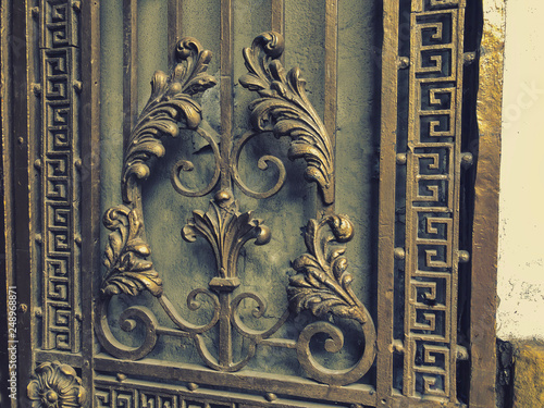 Ornament, detail of an iron gate. Decor and ornament of iron-forged city streets. Old Tbilisi architecture