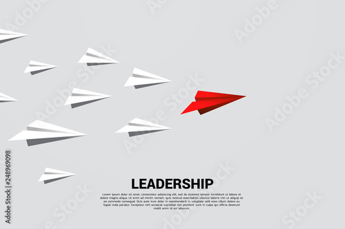 red origami paper airplane leading group of white. Business Concept of leadership and vision mission.
