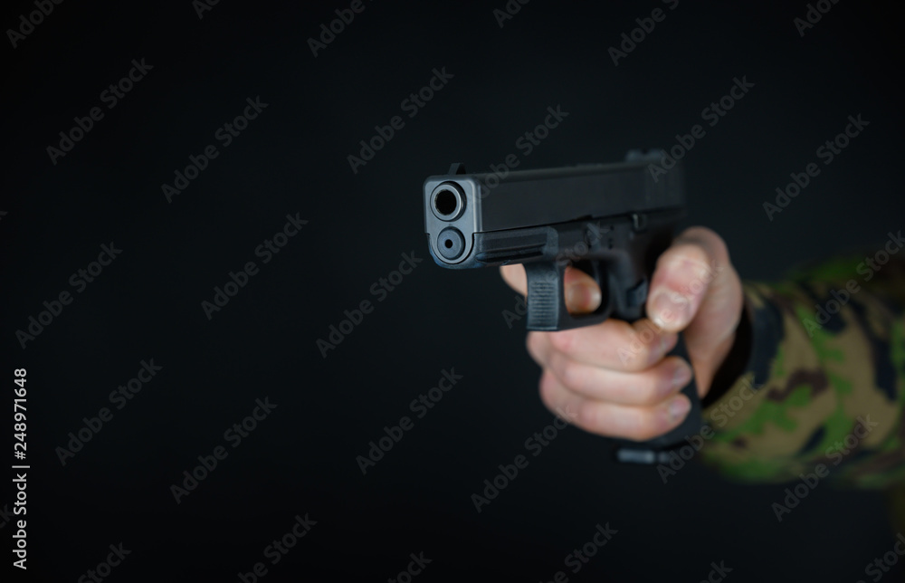 Soldier holds gun in the hand Soldier holds gun in the hand