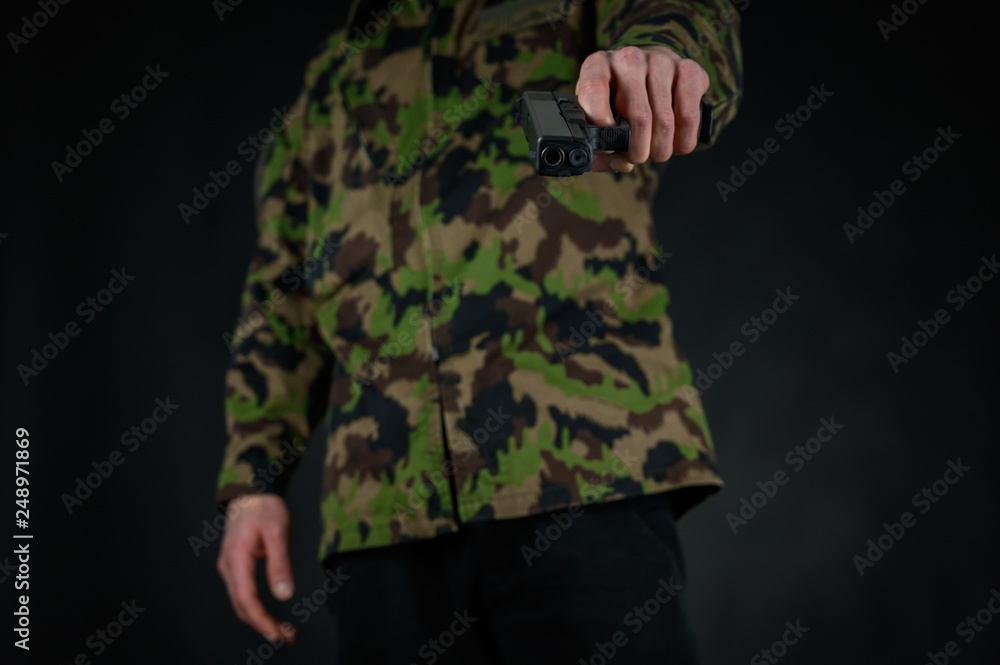 Soldier hold his gun