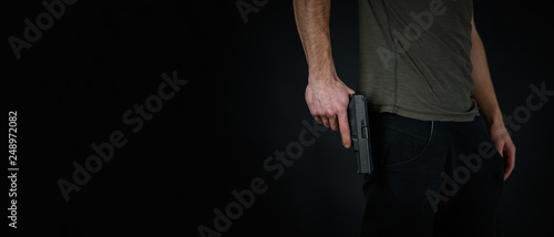 Wallpaper Mural Man with a pistol in the hand Torontodigital.ca