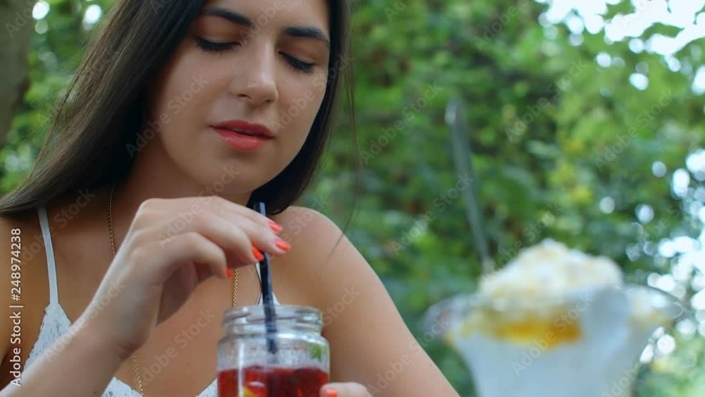 Girl drinking lemonade.