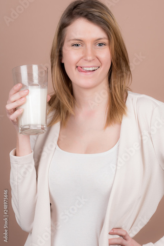 girl drinks milk and is happy