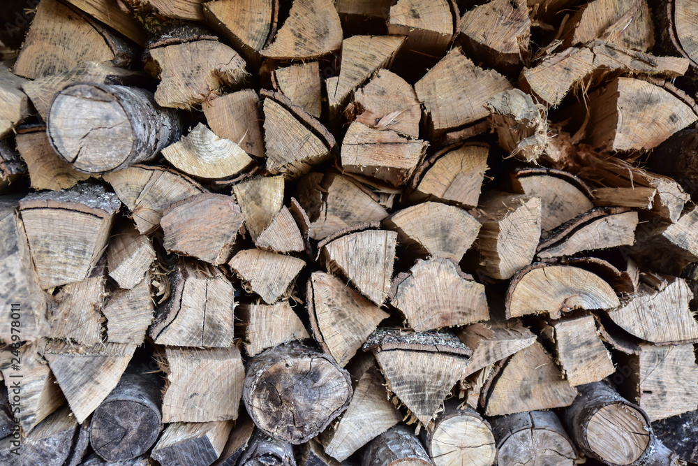 Fototapeta premium woodpile logs stacked together