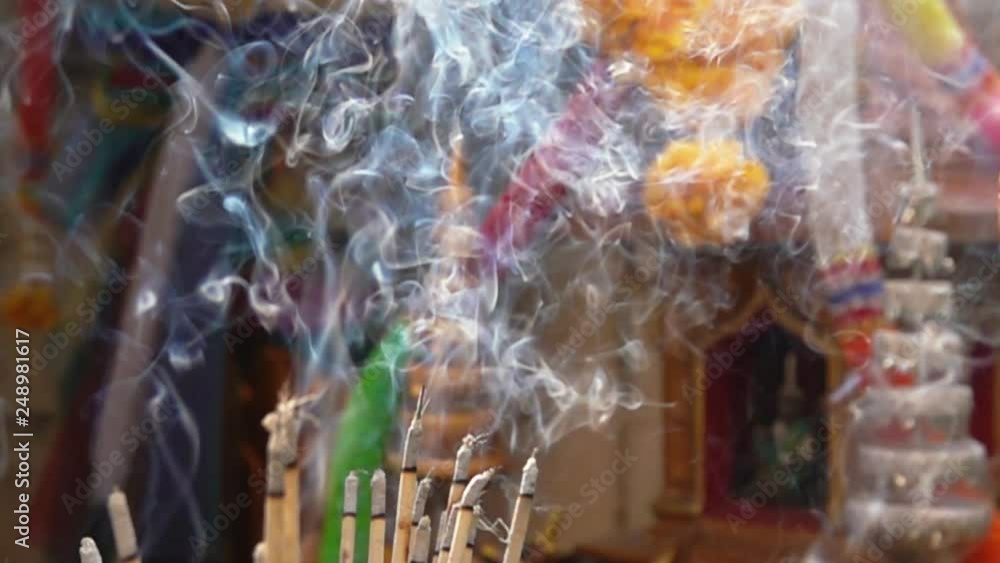 blurred Incense sticks burning with smoke slow motion blurred Incense sticks burning with smoke slow motion